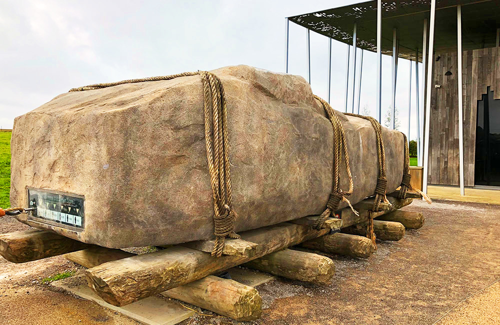 Replica stone rolled on logs
